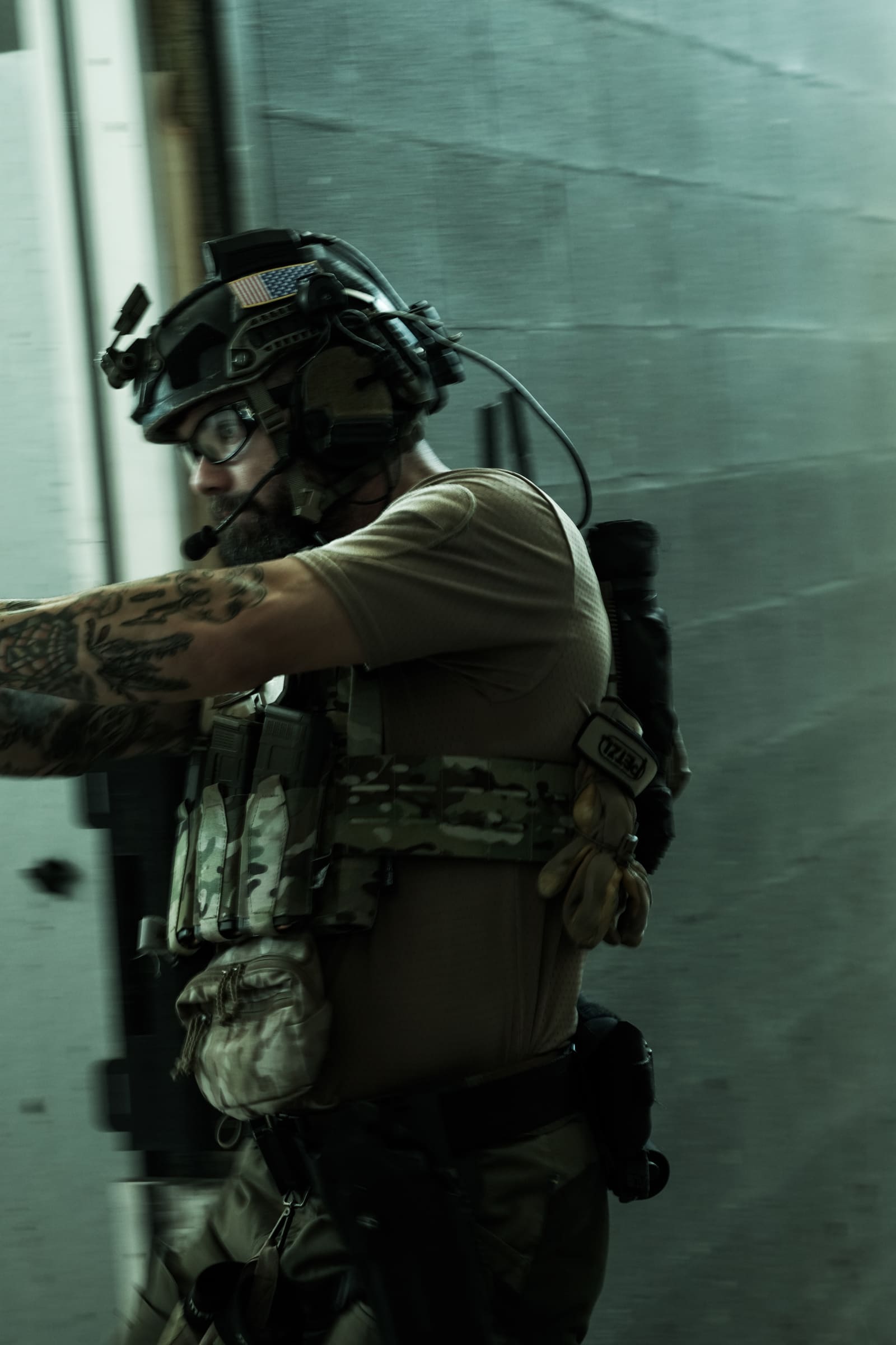Operator moving fast past a steel wall inside a structure