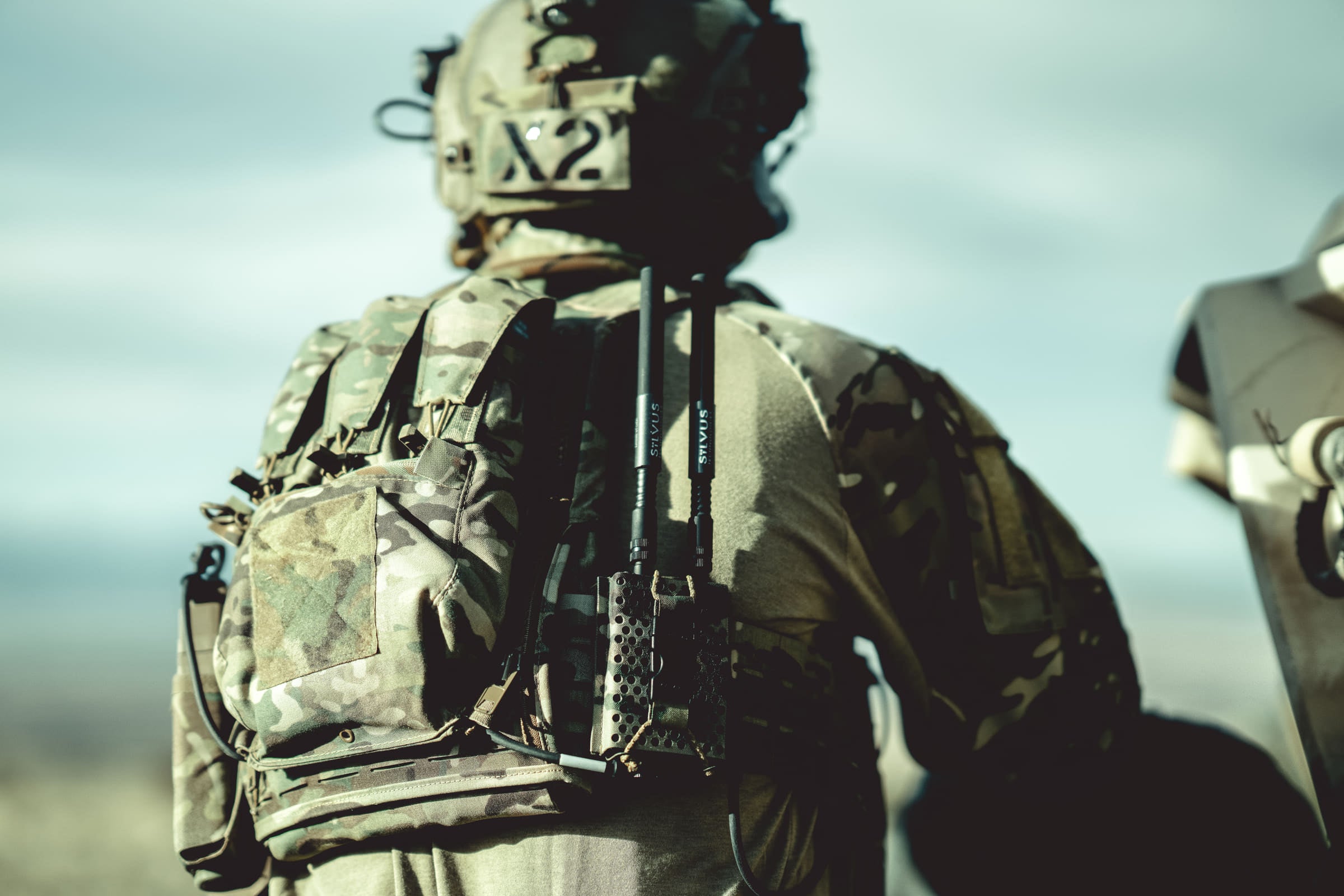Rear of a plate carrier showing the modular attachment panel and stowed antennas